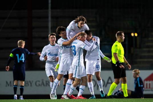 Dmitrii Vasilev of Zenit celebrate with teammates