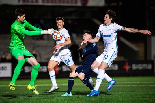 Isak Bjerkebo of Malmö FF against goalkeeper Georgii