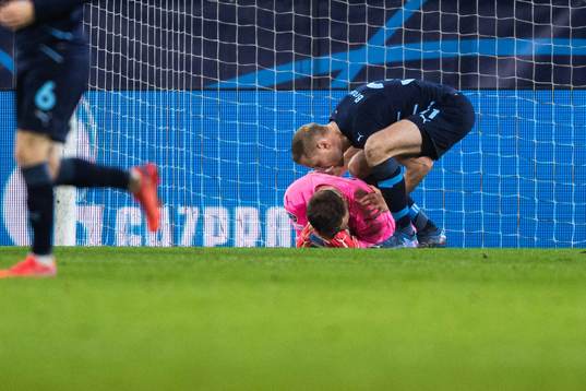 Franz Brorsson and goalkeeper Johan Dahlin of Malmö FF