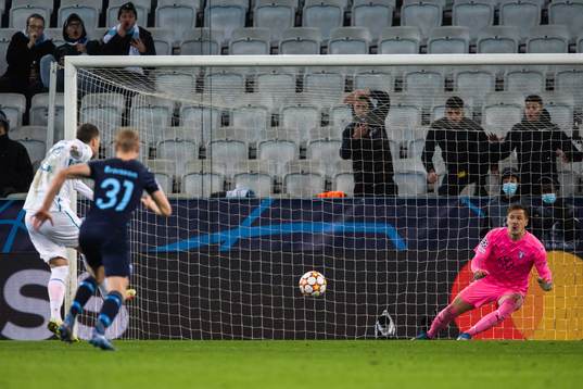 Goalkeeper Johan Dahlin of Malmö FF saves a penalty from
