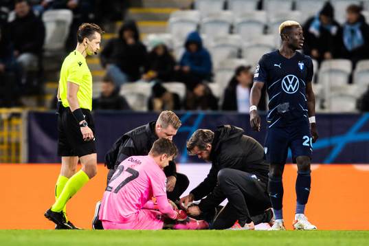 Goalkeeper Johan Dahlin of Malmö FF receives medical