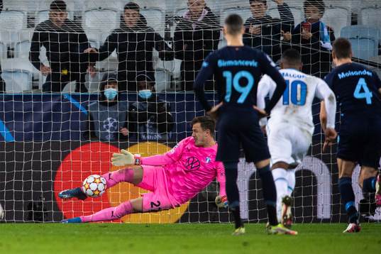 Goalkeeper Johan Dahlin of Malmö FF saves a penalty from