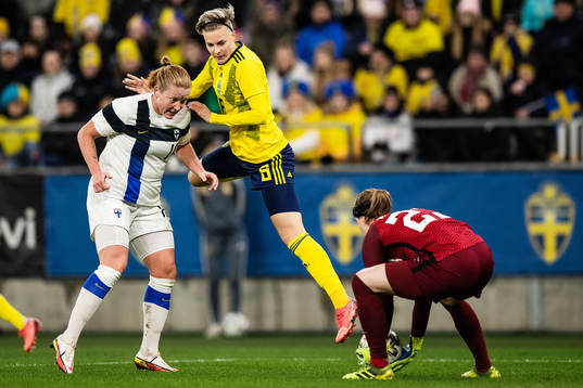 Anna Westerlund and goalkeeper Tinja-Riikka Korpela of