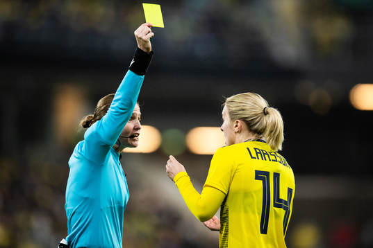 Mimmi Larsson of Sweden ash shown a yellow card