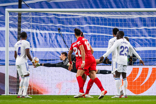 Rafa Mir of Sevilla scores 0-1 behind goalkeeper Thibaut