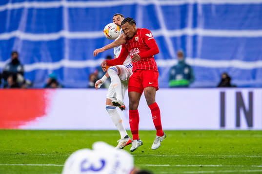 Karim Benzema of Real Madrid and Jules Kounde of Sevilla