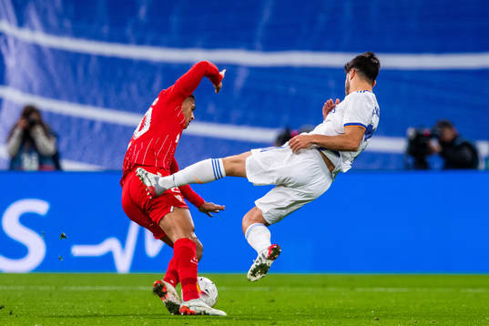 Diego Carlos of Sevilla and Marco Asensio of Real Madrid