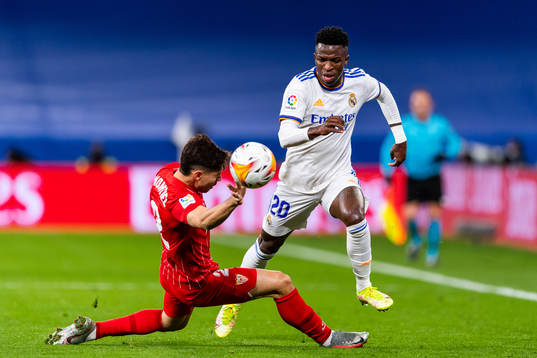 Gonzalo Montiel of Sevilla and Vinicius Junior of Real