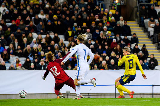 Lina Hurtig of Sweden scores the 1-0 goal behind goalkeeper