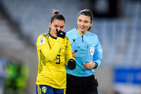 Johanna Rytting Kaneryd of Sweden and referee Angelika