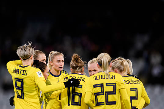 Fridolina Rolfö and Caroline Seger of Sweden celebrate the