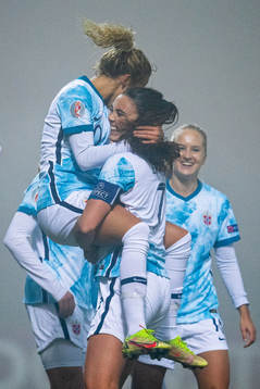 Celin Bizet Ildhusøy of Norway celebrates with teammate