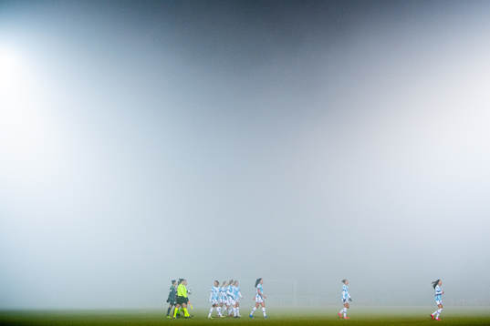 Vicotria Beyer, referee, and the players of Norway walk off