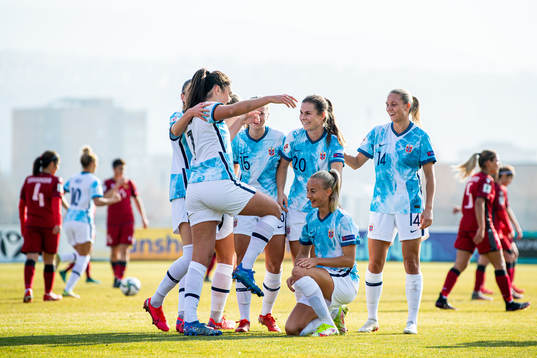 Ingrid Syrstad Engen of Norway celebrates with teammates