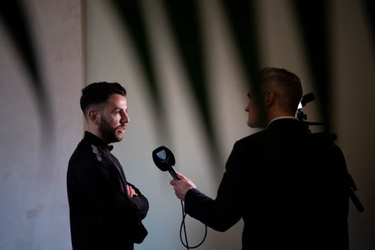 Erdal Rakip is interviewed at the team hotel