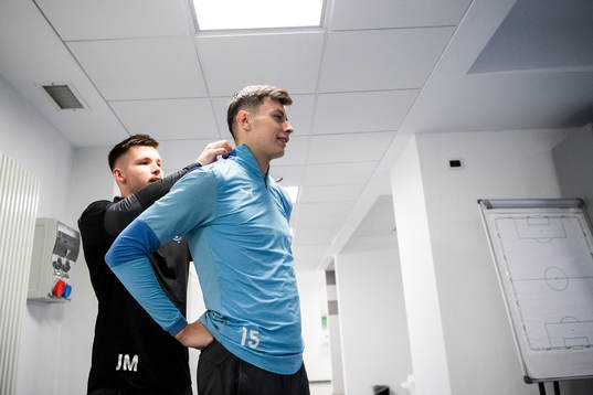 Physio Jamie Mackay and Anel Ahmedhodzic in the dressing