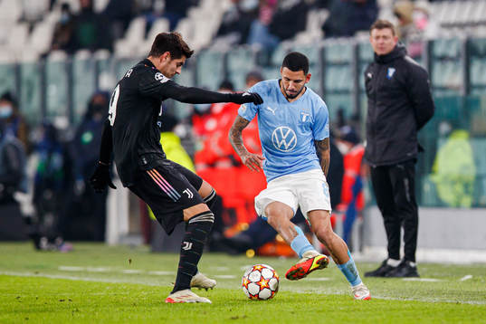Alvaro Morata of Juventus and Sergio Pena of Malmö FF