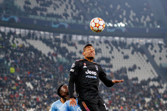 Malik Abubakari of Malmö FF and Alex Sandro of Juventus