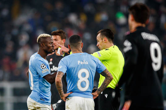 Bonke Innocent of Malmö FF and Referee Irfan Peljto