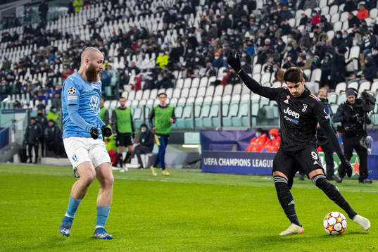 Jo Inge Berget of Malmö FF and Alvaro Morata of Juventus