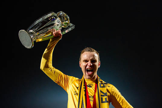Marius Lode of Bodø/Glimt celebrates with the trophy