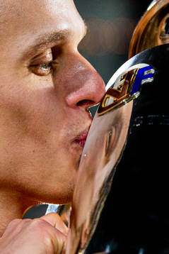 Ulrik Saltnes of Bodø/Glimt kisses the trophy winning the