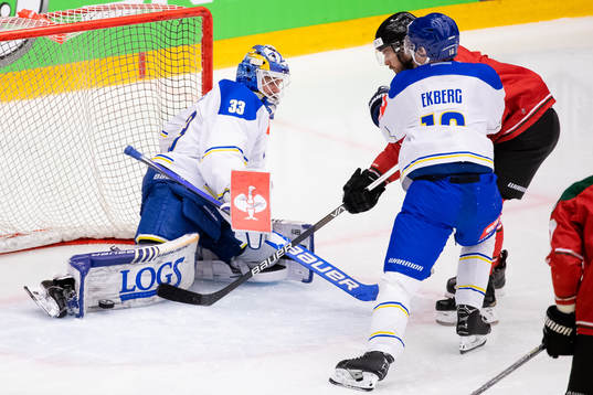 Goalkeeper Axel Brage saves a shot from Michael Spacek of