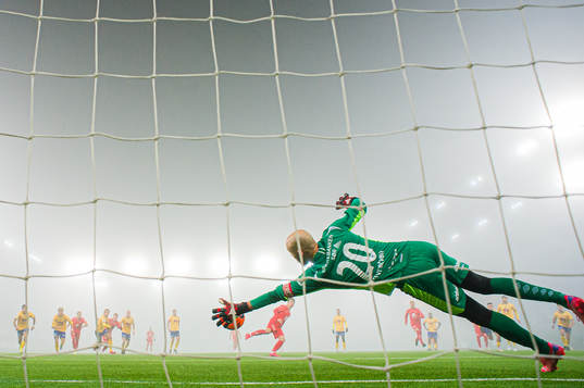 Øystein Øvretveit of Jerv saves a penalty kick by Mathias