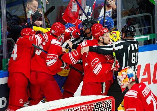Players of Russia and of Sweden fight