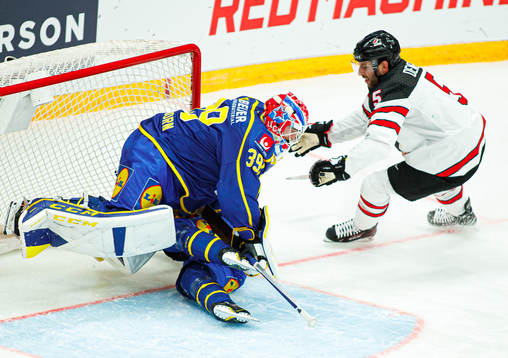 Goalkeeper Adam Reideborn of Sweden and Jason Demers of