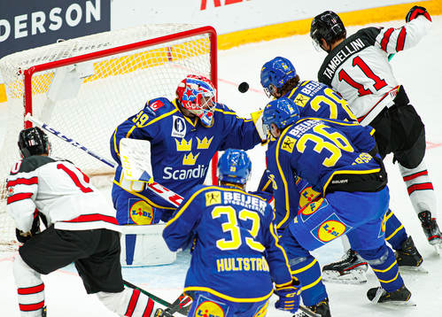 Adam Reideborn of Sweden vies of Canada