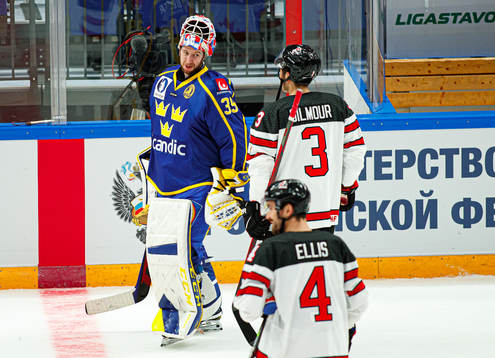 Goalkeeper Adam Reideborn of Sweden and C John Gilmore of