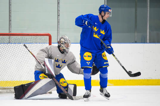 Goaltender Jesper Vikman and Isak Rosén of the Swedish