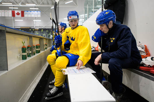 Elliot Ekmark and assistant coach Joel Rönnmark of the