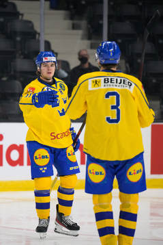 Alexander Holtz of Sweden celebrates scoring the 3-0 goal