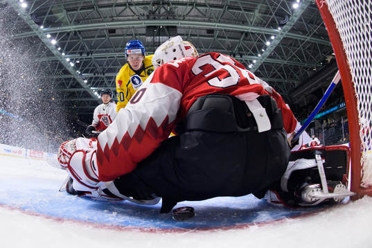 Albert Sjöberg of Sweden scores 2-0 behind goaltender