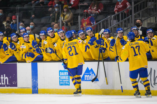 Oskar Olausson of Sweden celebrates with teammates