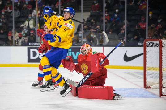 William Eklund of Sweden blocks goaltender Yaroslav Askarov