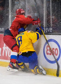 Dmitri Zlodeyev of Russia tackles Oskar Magnusson of Sweden