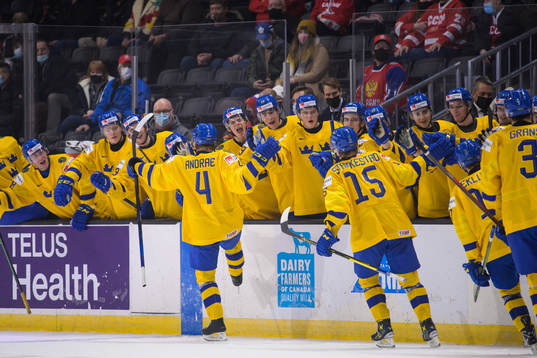 Emil Andrae of Sweden celebrates with teammates
