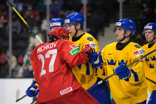 Matvey Michkov of Russia in a fight against Simon Edvinsson