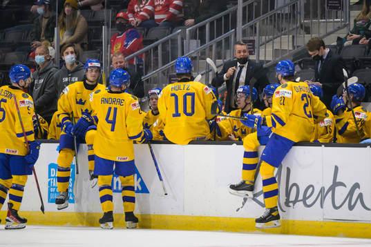 Head coach Tomas Montén of Sweden talks to players at a