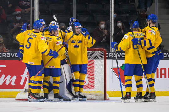 Players of Sweden celebrate their win