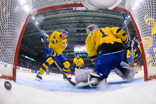 Simon Edvinsson and goaltender Jesper Wallstedt of Sweden