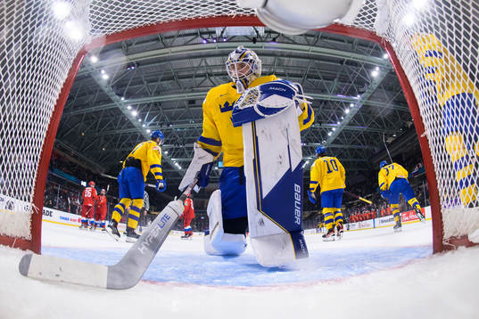 Goaltender Jesper Wallstedt of Sweden looks dejected