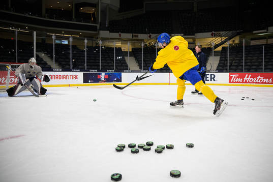 Goaltender Jesper Vikman and Måns Forsfjäll of Sweden at