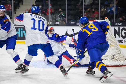 Goaltender Simon Latkoczy of Slovakia saves a a shot from