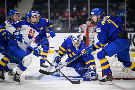 Juraj Slafkovsky of Slovakia challenges goaltender Jesper
