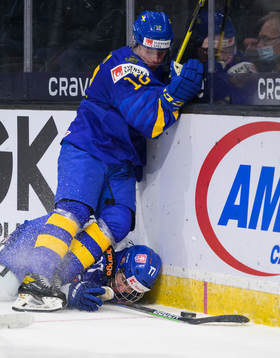 Simon Nemec of Slovakia falls against Victor Sjöholm of