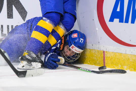 Simon Nemec of Slovakia falls against Victor Sjöholm of